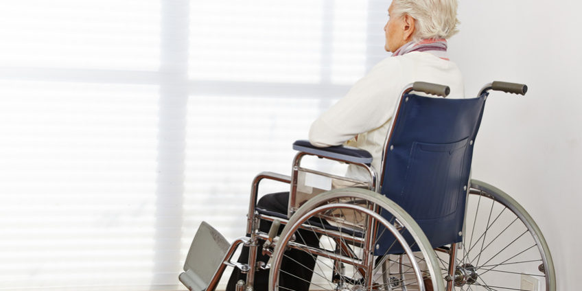 Lonely senior woman in wheelchair